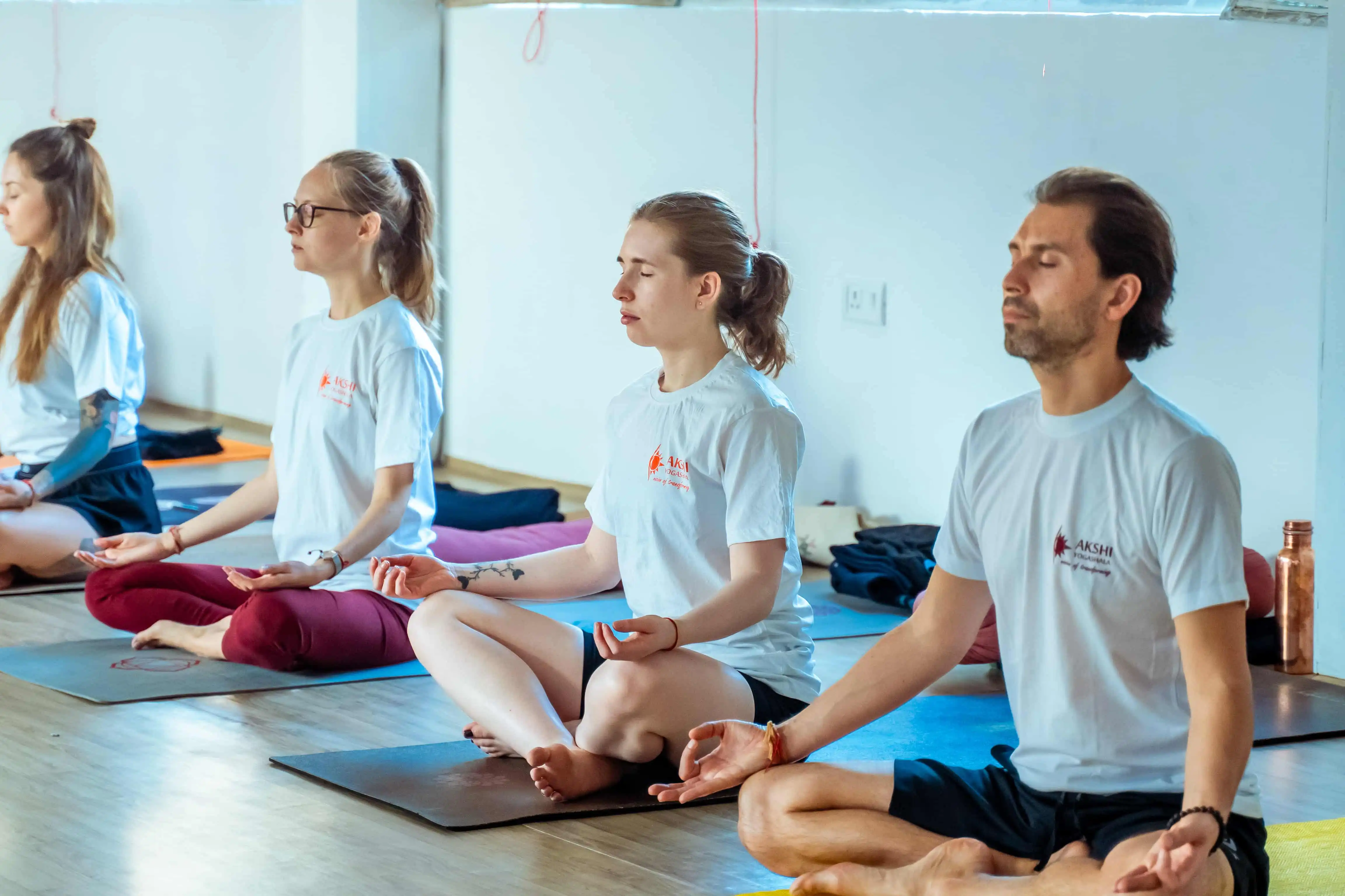 Students practicing meditation in Rishikesh